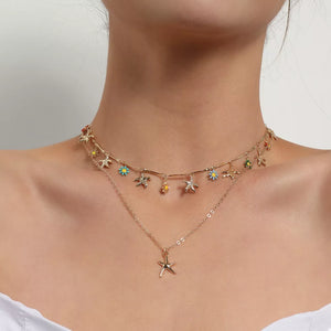 Gold necklace featuring double-layered and starfish