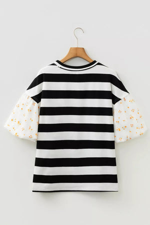 Maternity t-shirt with black and white stripes and floral puff sleeves.