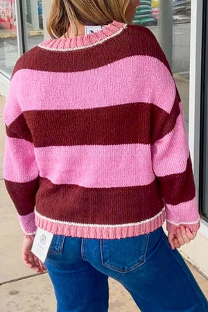 50% recycled polyester, 50% polyester Care instructions: Machine wash cold pullover sweater in Pink with relaxed silhouette
