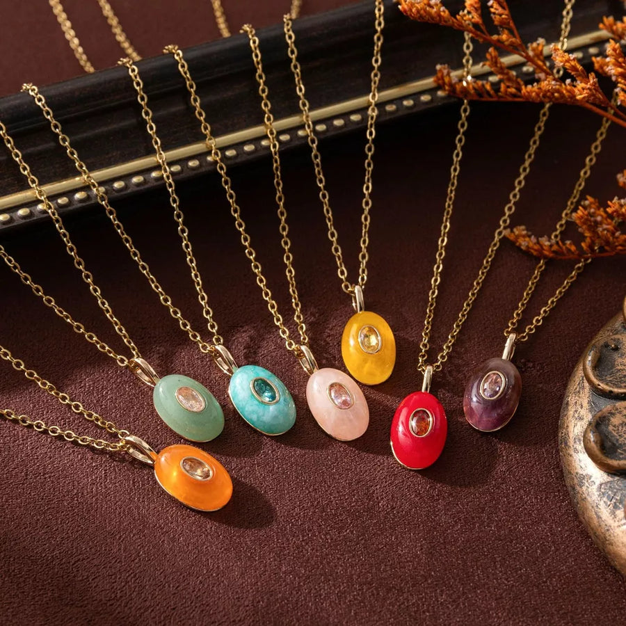 necklace in gold featuring natural stone pendant and delicate chain with oval pendant fit