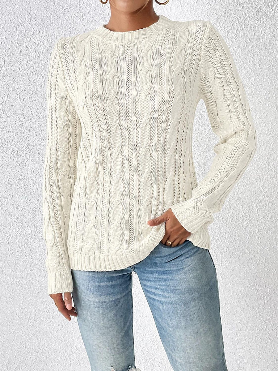 Ivory cable knit sweater with mock neck and long sleeves.