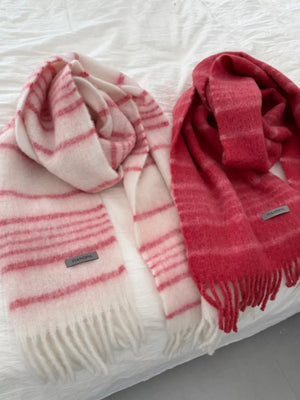 Chic striped fringe hem scarves in red and pink, soft fuzzy knit with tassel trim.