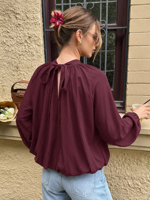 burgundy blouse with balloon sleeves and balloon sleeve