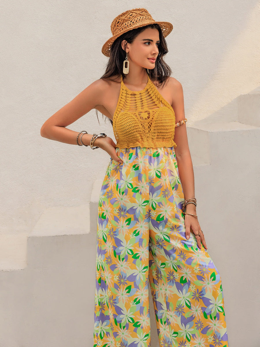 Gold crochet halter jumpsuit with a floral print palazzo pant and wide legs.