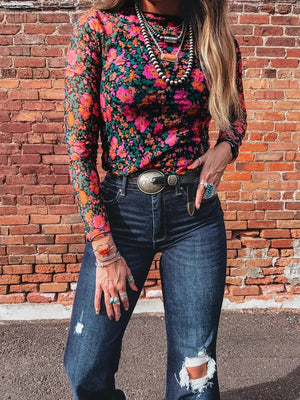 orange top featuring sheer and floral