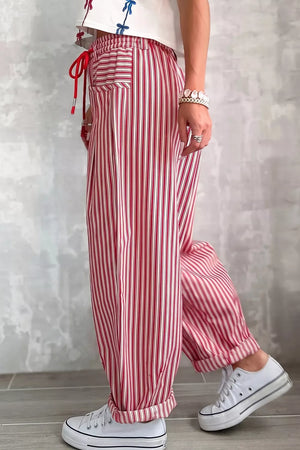 cream wide-leg pants featuring drawstring waist and striped
