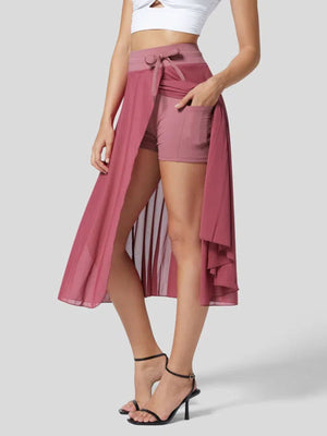 Flowy midi skirt with shorts liner in Rose Red, featuring a drawstring waist and pockets.