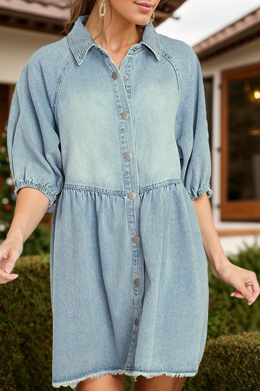 Light wash denim shirtdress with gathered yoke, button front, and puff sleeves.