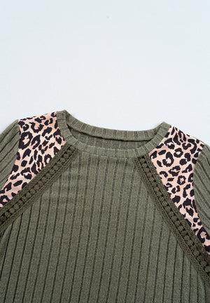 Army green ribbed knit top with leopard print shoulder panels and lace trim.