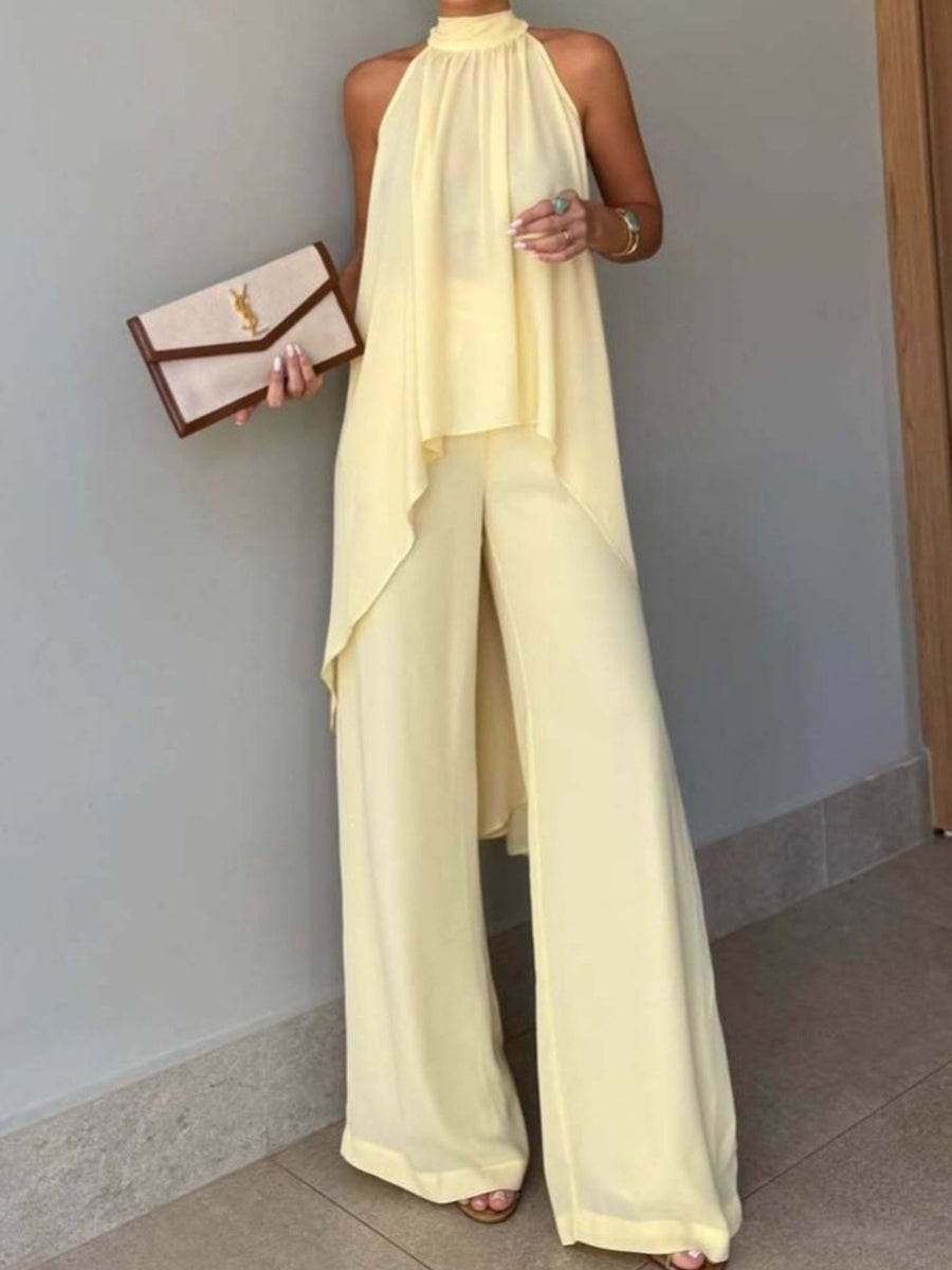 two-piece set in pale yellow featuring high-low and relaxed top with wide-leg pants fit