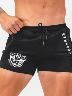 Black athletic shorts with drawstring, zipper pockets, and graphic logo detail.