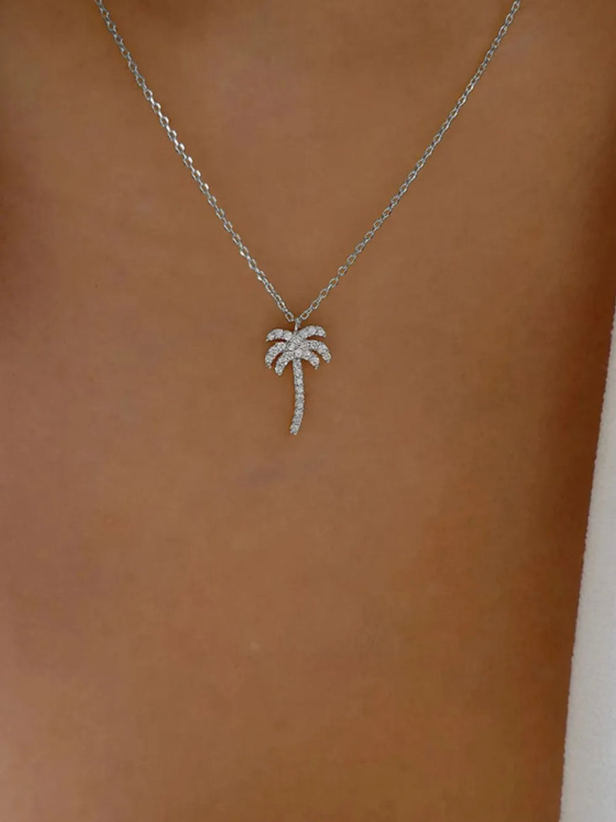 clear necklace featuring adjustable chain and palm tree motif