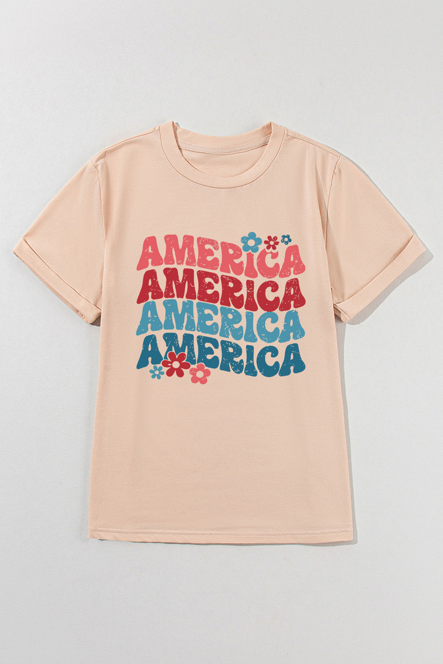 Tan t-shirt with stacked "America" graphic and flowers, 70s-inspired style