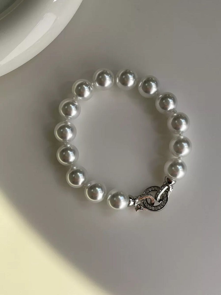 White pearl beaded bracelet with ornate clasp