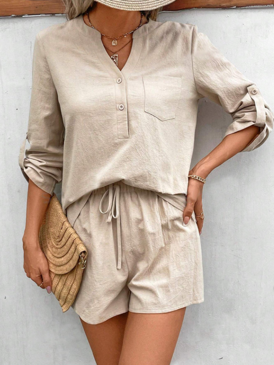 Tan linen henley shirt with rolled sleeves and drawstring shorts set.