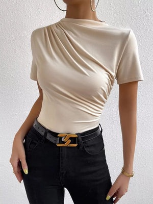 Apricot ruched mock neck t-shirt with draped detail and short sleeves.