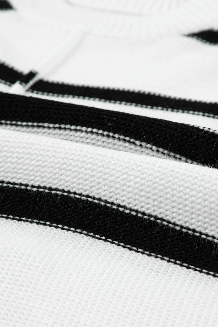 Horizontal stripe knit shell top in white with black stripes, acrylic knit fabric.