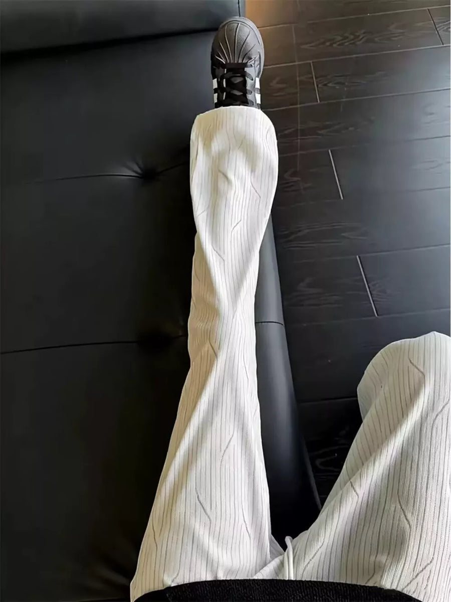 dark gray wide-leg pants featuring drawstring waist and striped