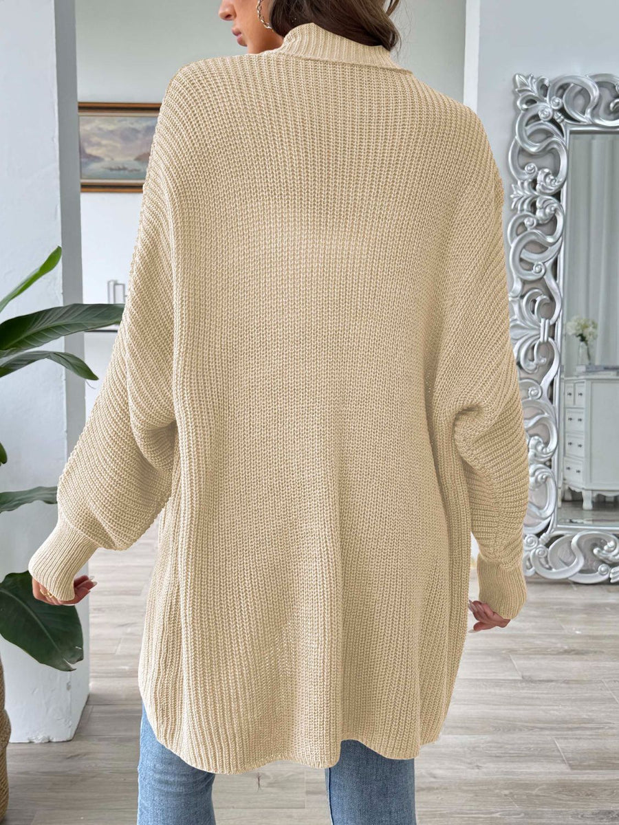 Pearl button ribbed knit cardigan in tan, featuring a relaxed fit and long sleeves.