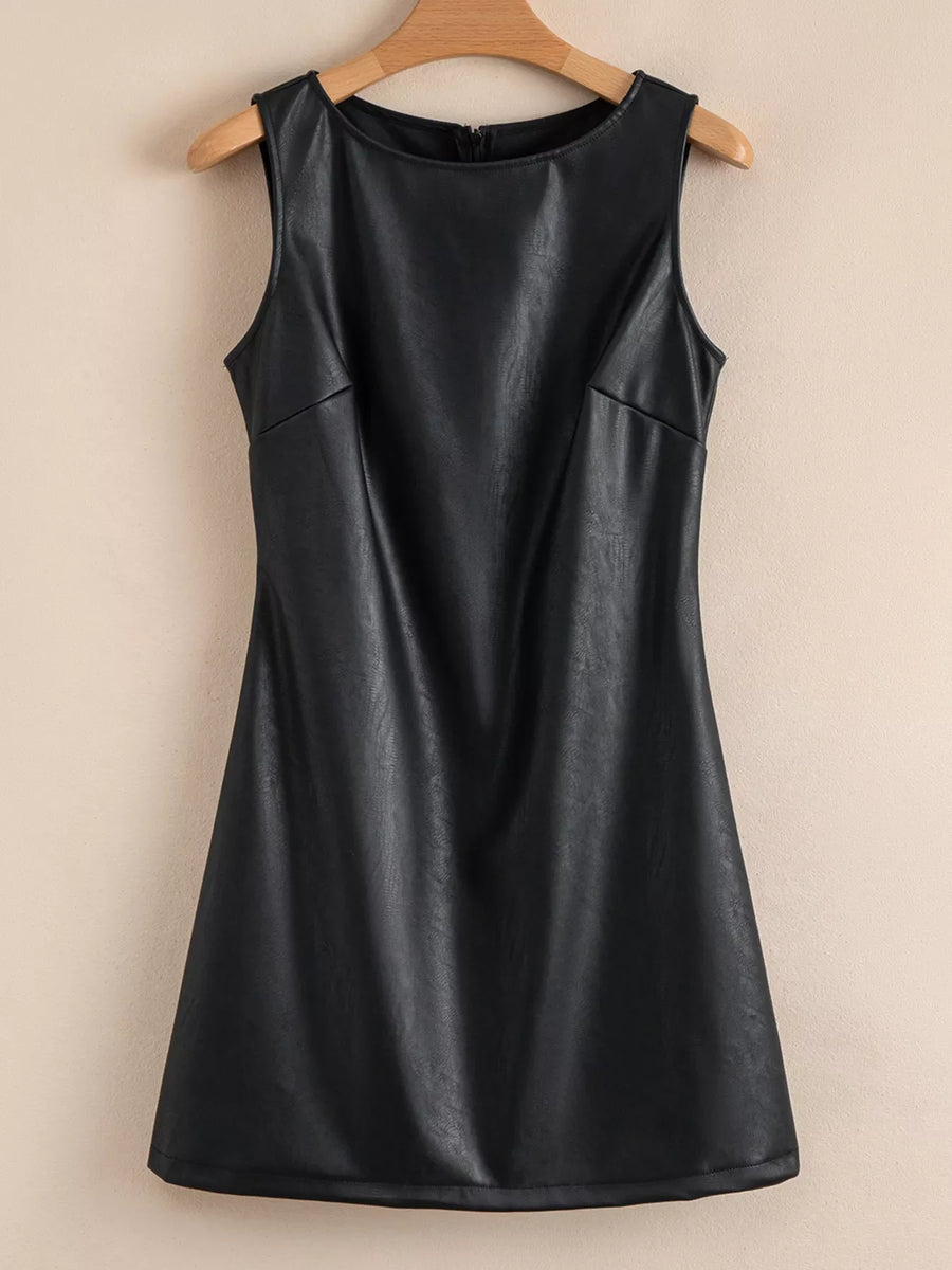 Black vegan leather sleeveless mini dress with a round neckline and zipper closure.