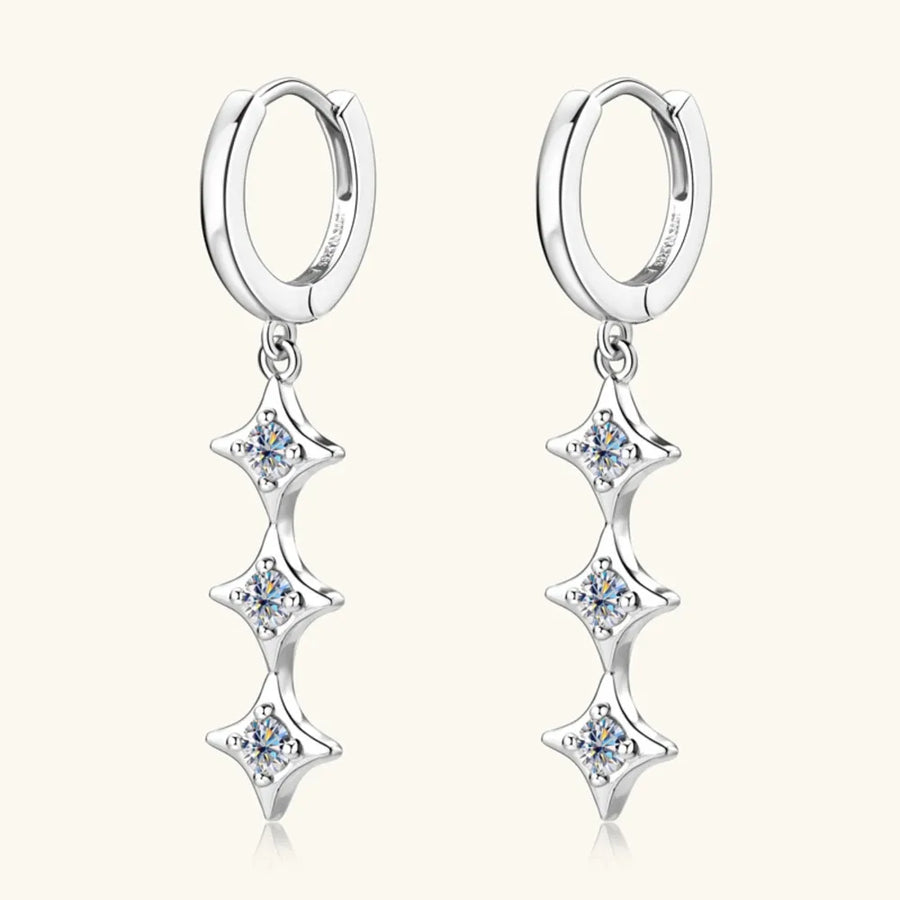 Silver hoop earrings with three cascading star-shaped moissanite charms.