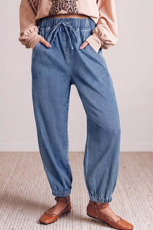 jeans in light wash denim blue featuring elastic waist and relaxed fit