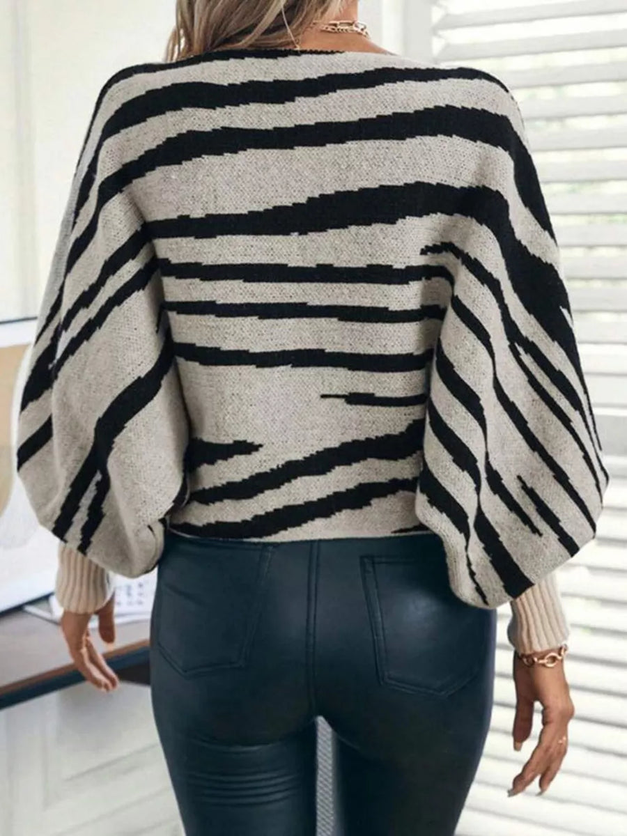 100% polyester Care instructions: Machine wash cold pullover sweater in Gray with relaxed silhouette