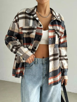 Relaxed fit plaid shirt jacket in mocha with button front and chest pockets.