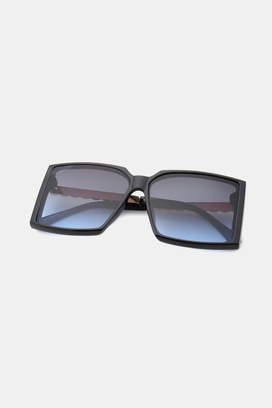 Black square sunglasses with gradient blue lenses and geometric edges.