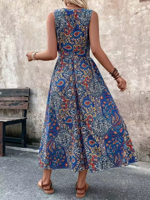 Multicolor paisley print maxi dress with cinched waist and sleeveless design.