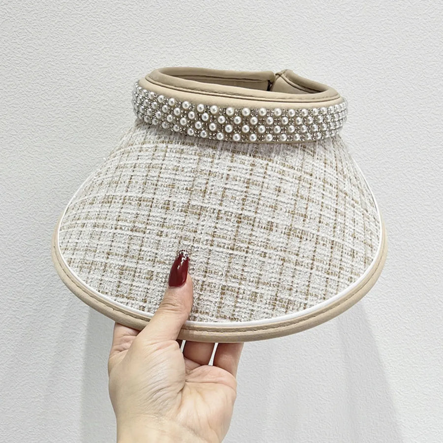 Beige tweed visor with pearl embellishments and a wide brim