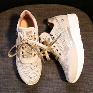 Khaki rhinestone embellished lace-up sneakers with chunky sole and side zipper detail.