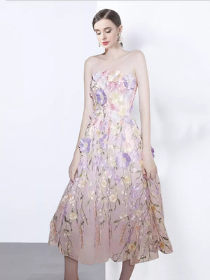 Strapless midi dress in pink with 3D floral applique and a-line skirt.