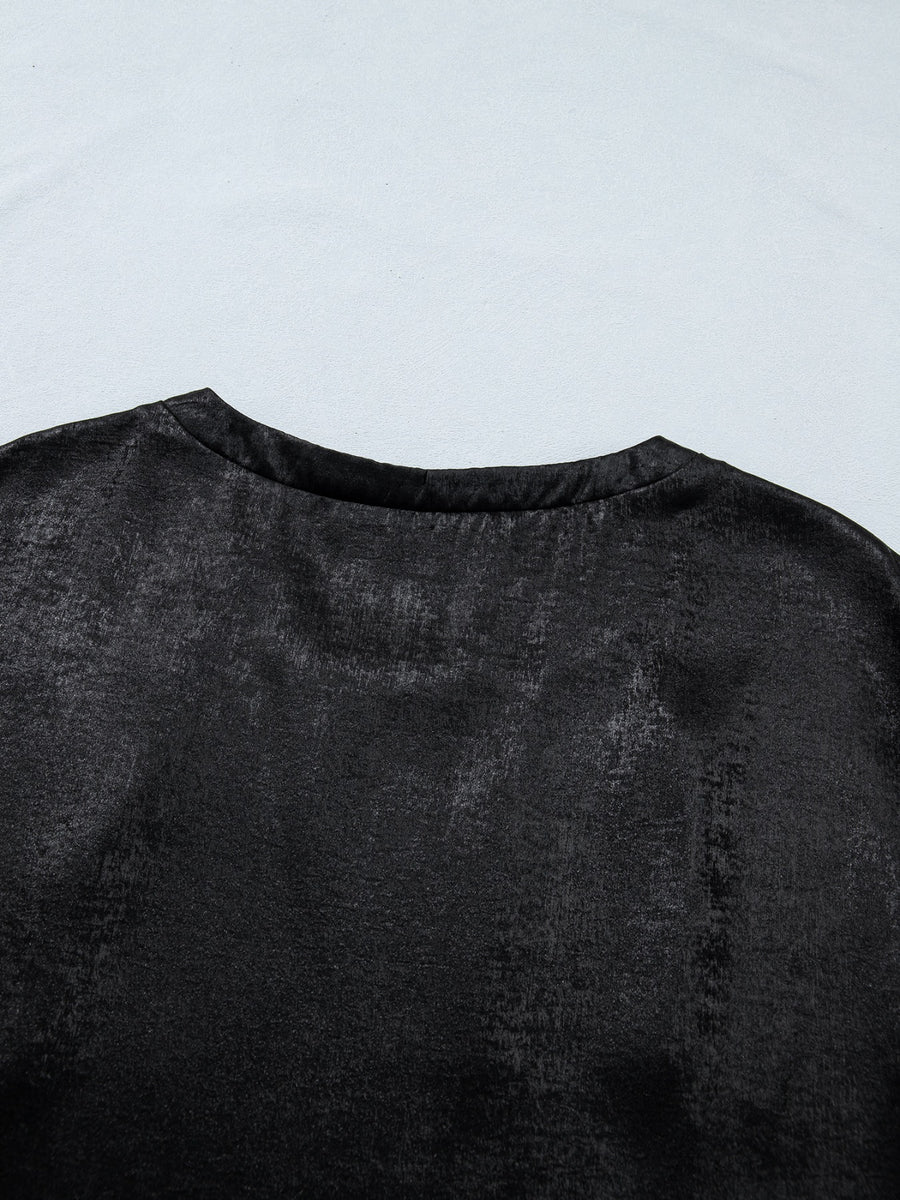 Black metallic tee with round neck and cap sleeves, made of polyester and spandex blend.