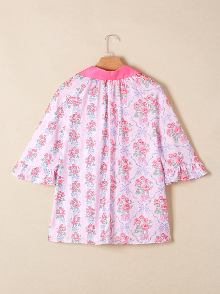 Pink floral and bow print maternity shirt with ruffled sleeves and pink collar.