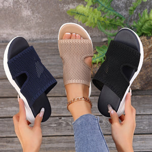 Airy open-toe mesh sandals in black, khaki, and dark blue with comfortable cushioned soles.