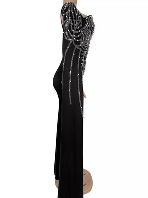 black formal gown with pearl embellishment and long sleeve