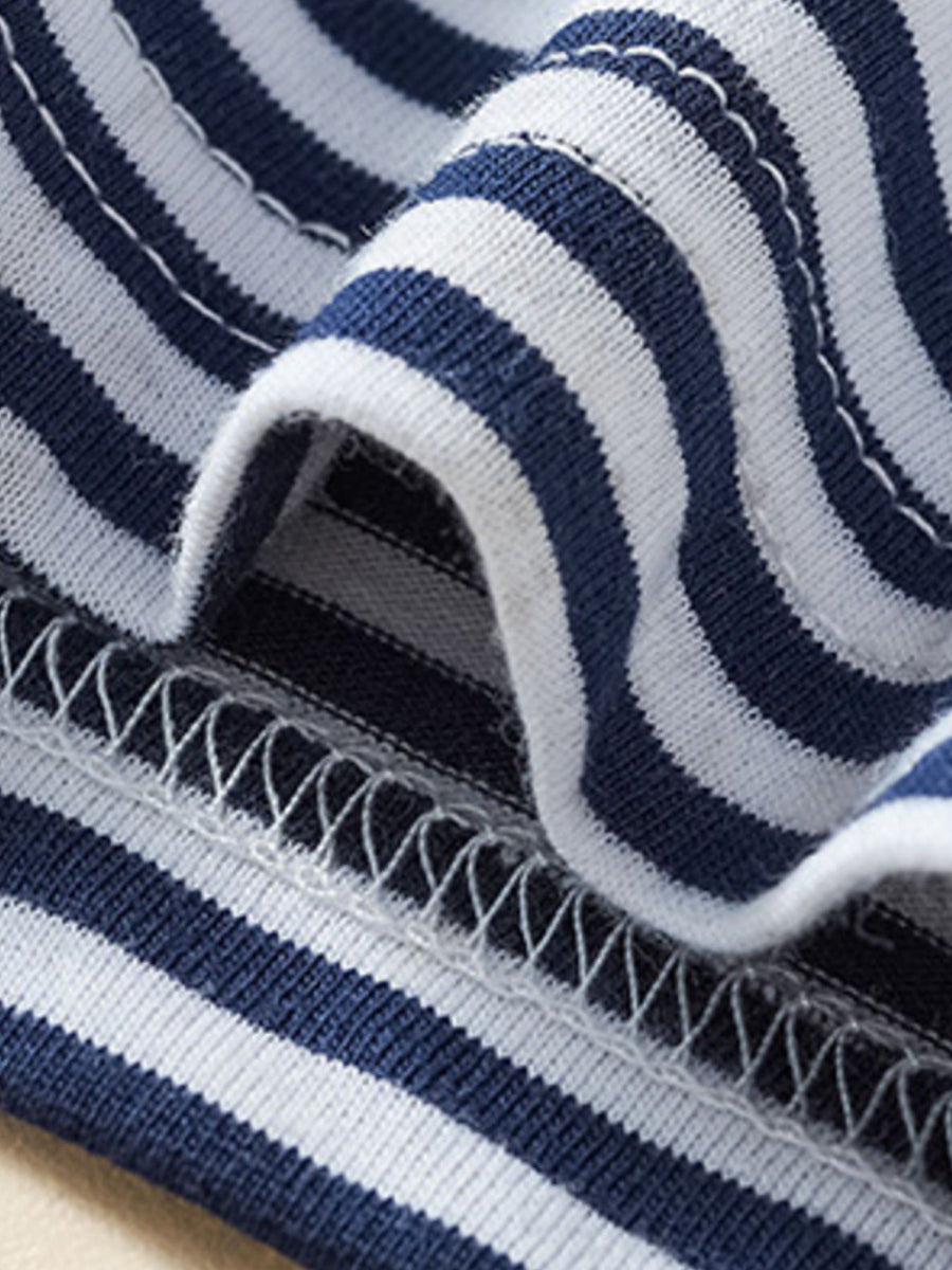 Toddler polo shirt and shorts set detail: navy and white striped cotton fabric with visible stitching.
