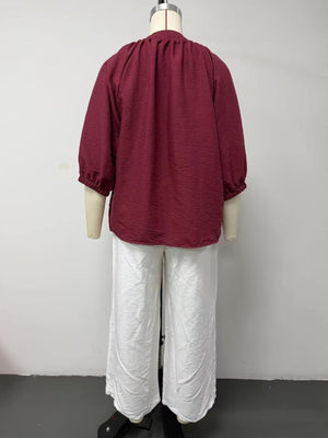 100% polyester Care instructions: Machine wash cold blouse and wide-leg pants set in White with relaxed silhouette