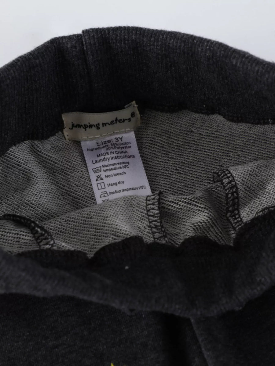 Black cotton blend joggers for kids with embroidered rocket detail