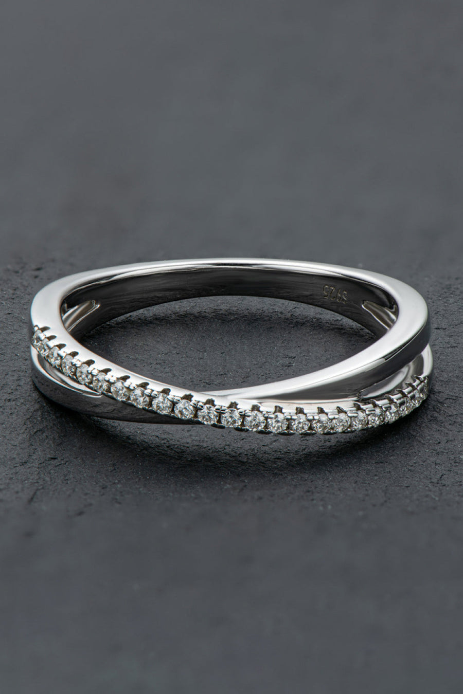 Silver crossover band ring with pavé moissanite stones on sterling silver.
