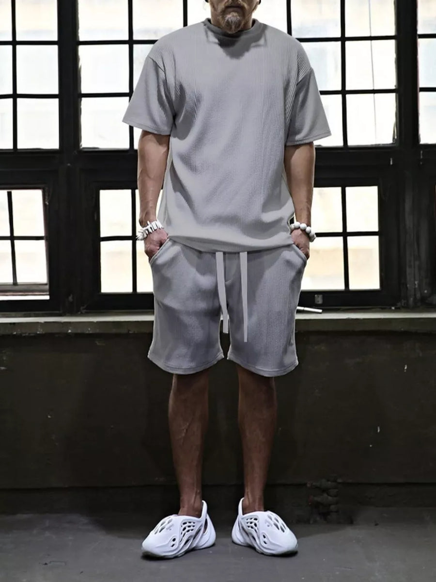 Men's grey ribbed t-shirt and drawstring shorts set with white accents