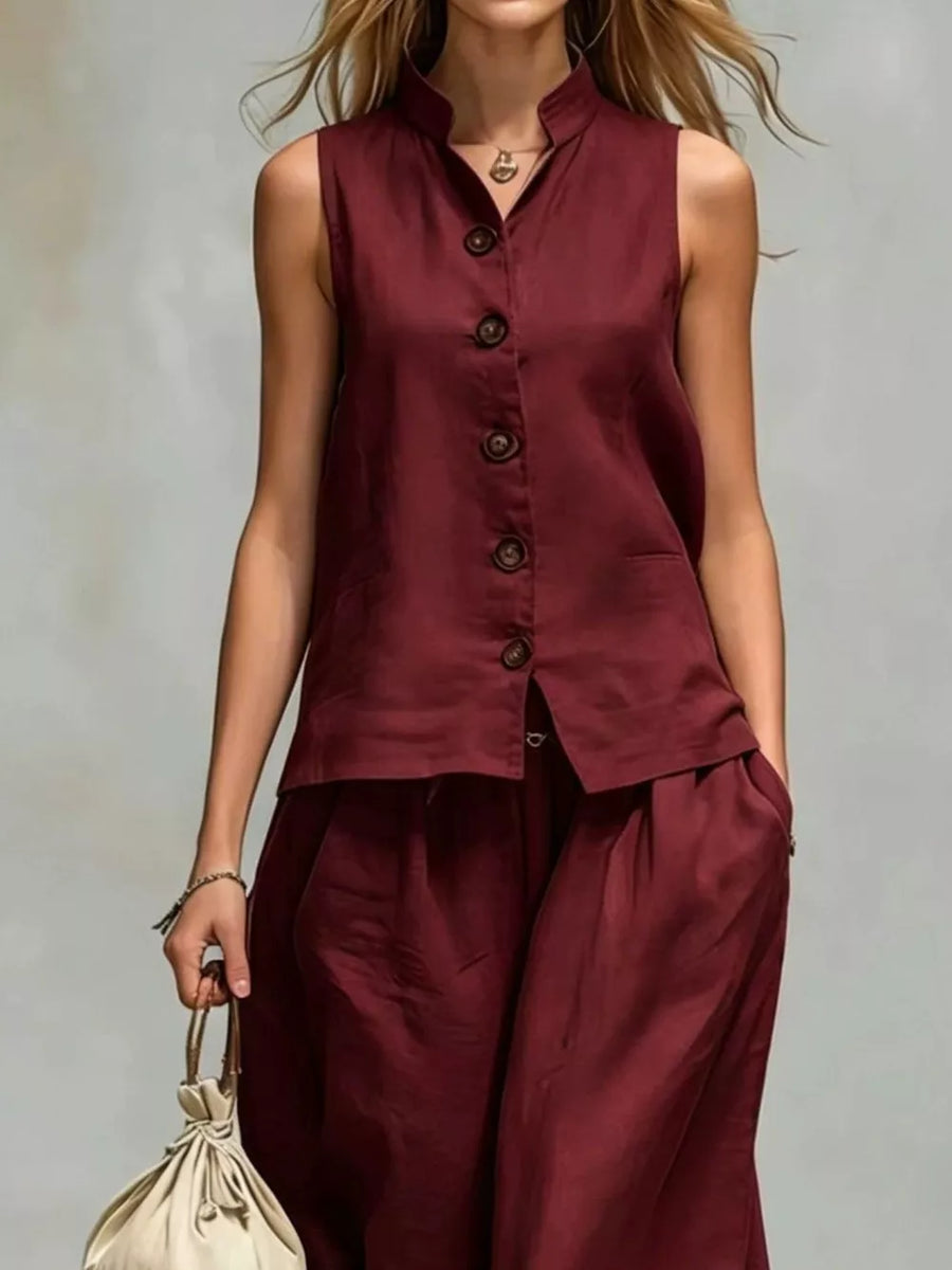 two-piece set in White with buttoned and hip-length top, full-length pants