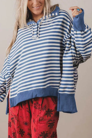 100% polyester Care instructions: Machine wash cold sweatshirt in Dusty Blue with loose silhouette