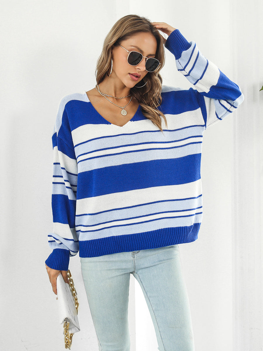 Blue and white striped V-neck acrylic sweater with a relaxed fit.