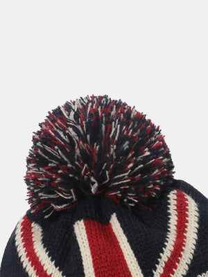 Union Jack knit beanie with red, white, and blue pom and stripes.