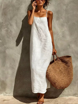 White linen-blend maxi dress with spaghetti straps and a relaxed fit.
