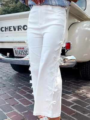 White cotton wide-leg maternity trousers with side bow embellishments