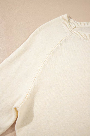 pullover sweater in White with decorative buttons and hip-length