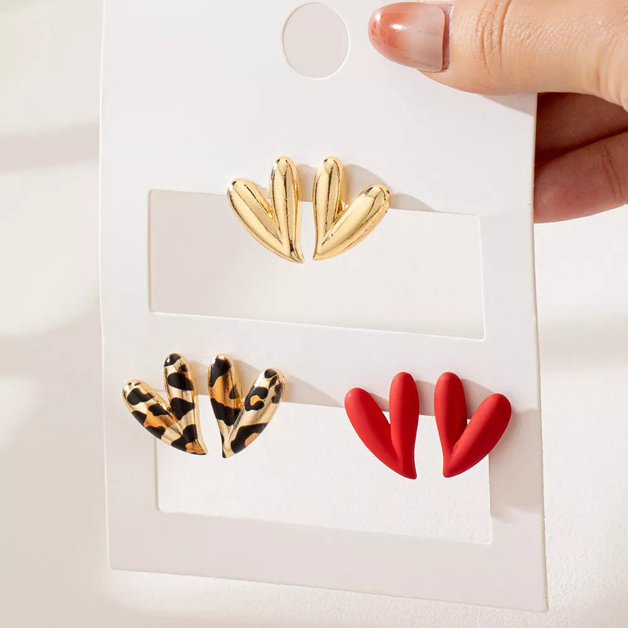 earrings in gold with leopard-print and heart-shaped